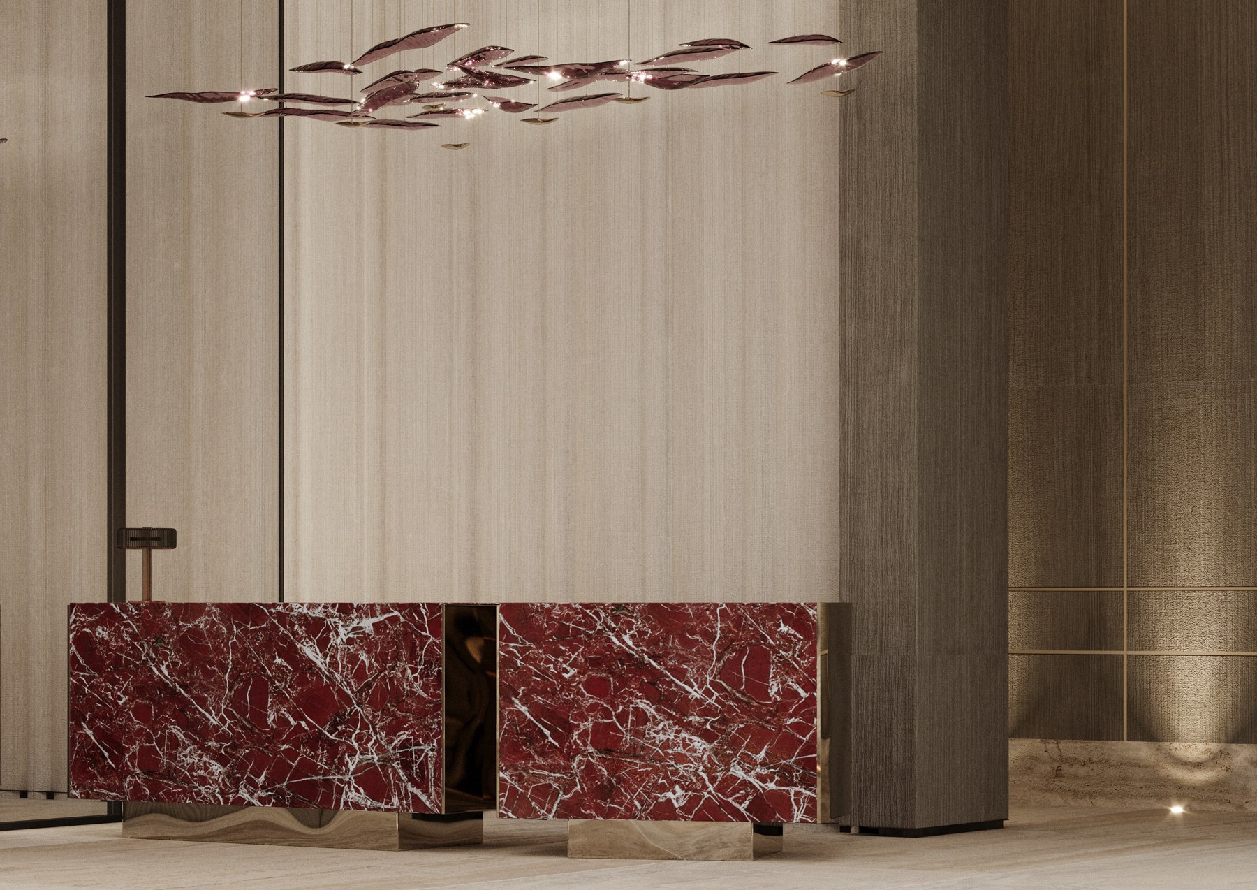 Red-veined stone reception desks beneath sculptural lighting