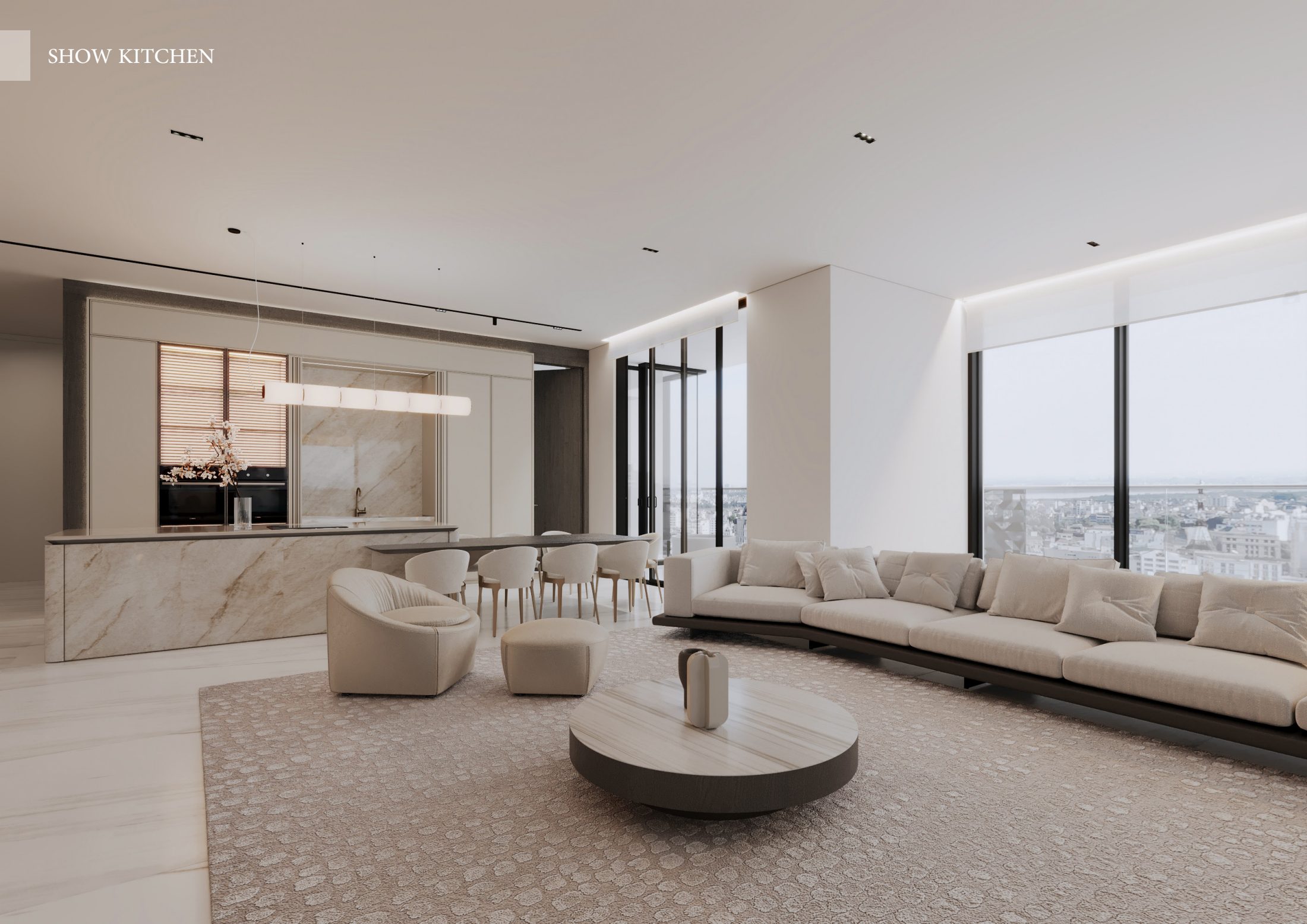 Open-plan living room with curved cream seating and a pale stone kitchen.