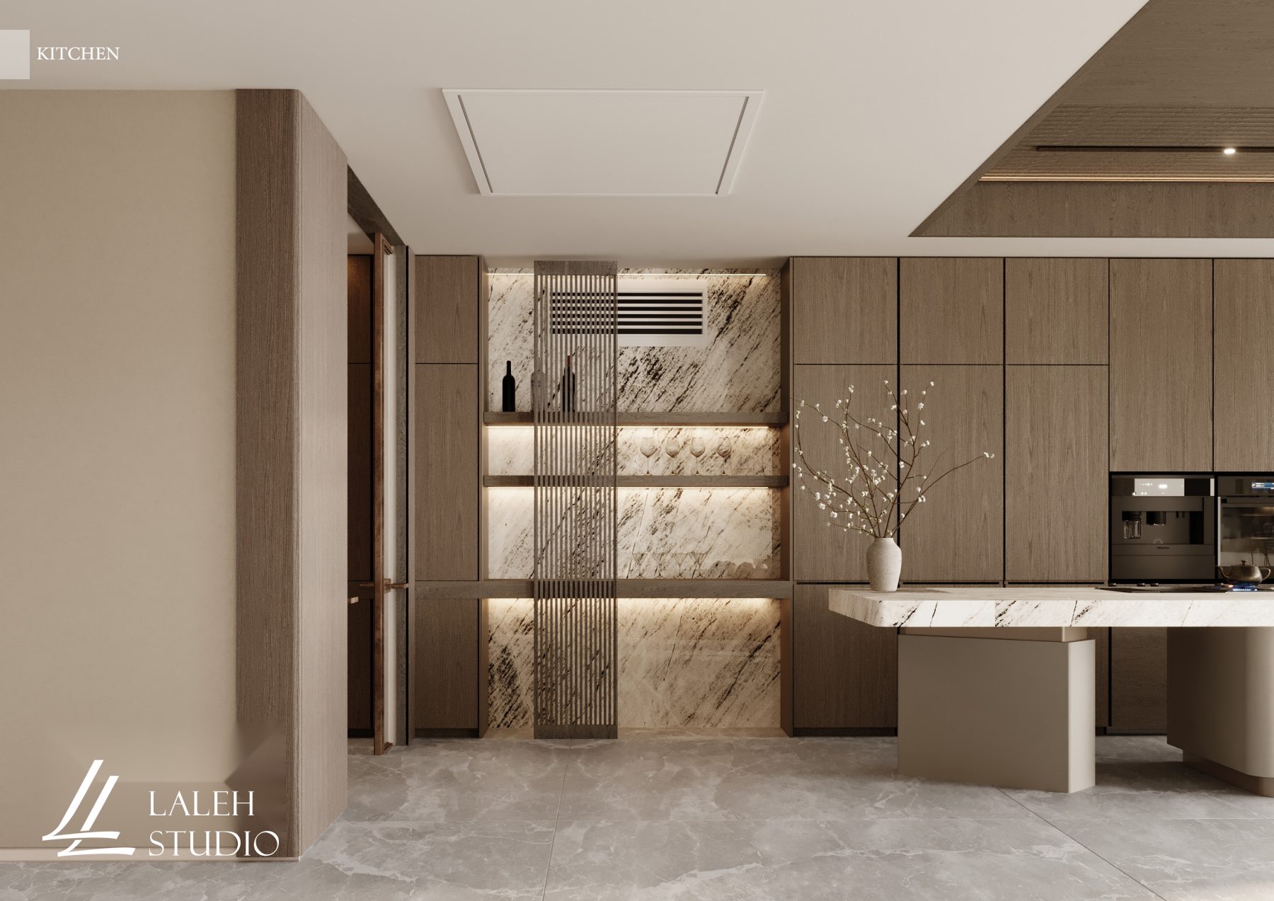 Stone kitchen island beside illuminated display shelves with original studio branding.